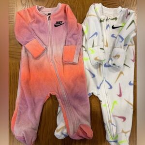 Two Nike Fleece one piece Sleep & Play pajamas!‎  Great used Condition.